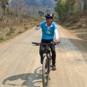 Man cycling in Laos