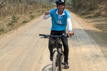 Man cycling in Laos