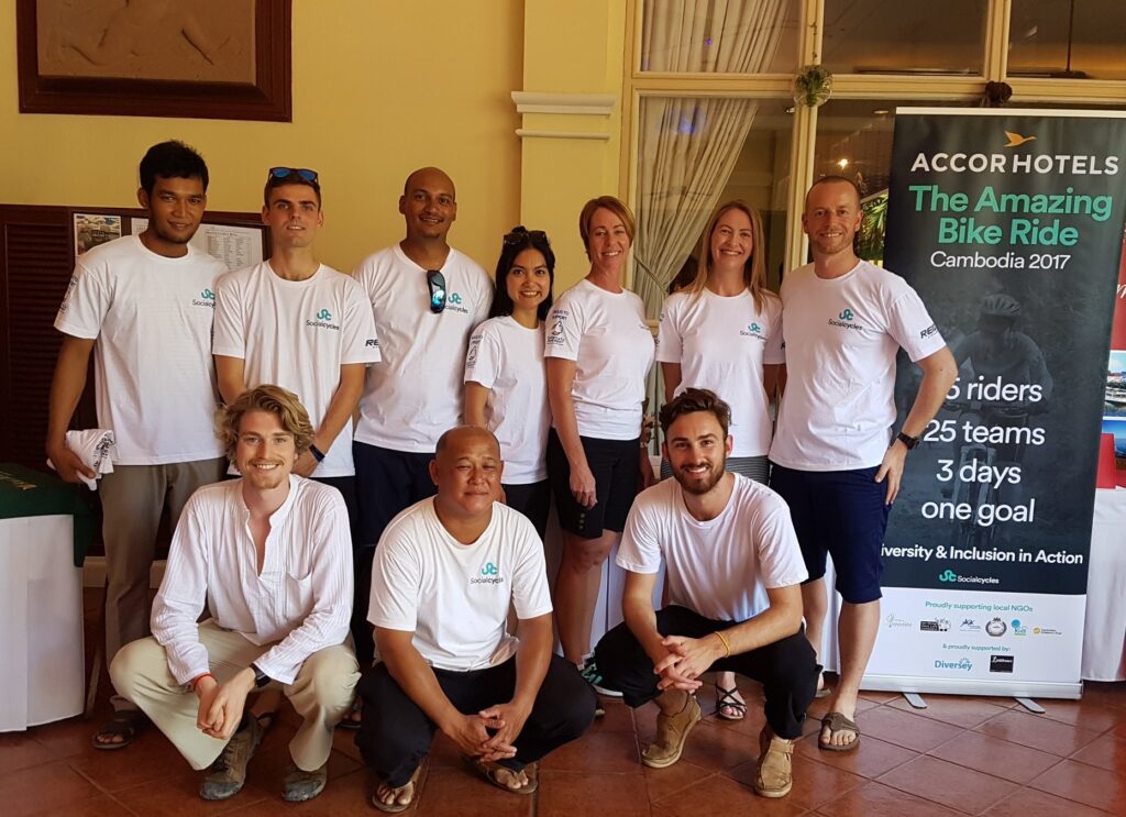 The ride crew beside the Amazing Bike Ride banner, Cambodia, November 2017