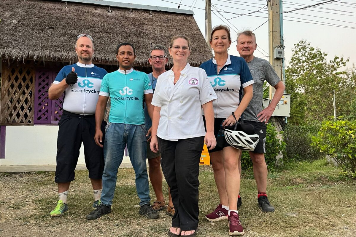 Riders in Social Cycles jerseys with their host in chef whites