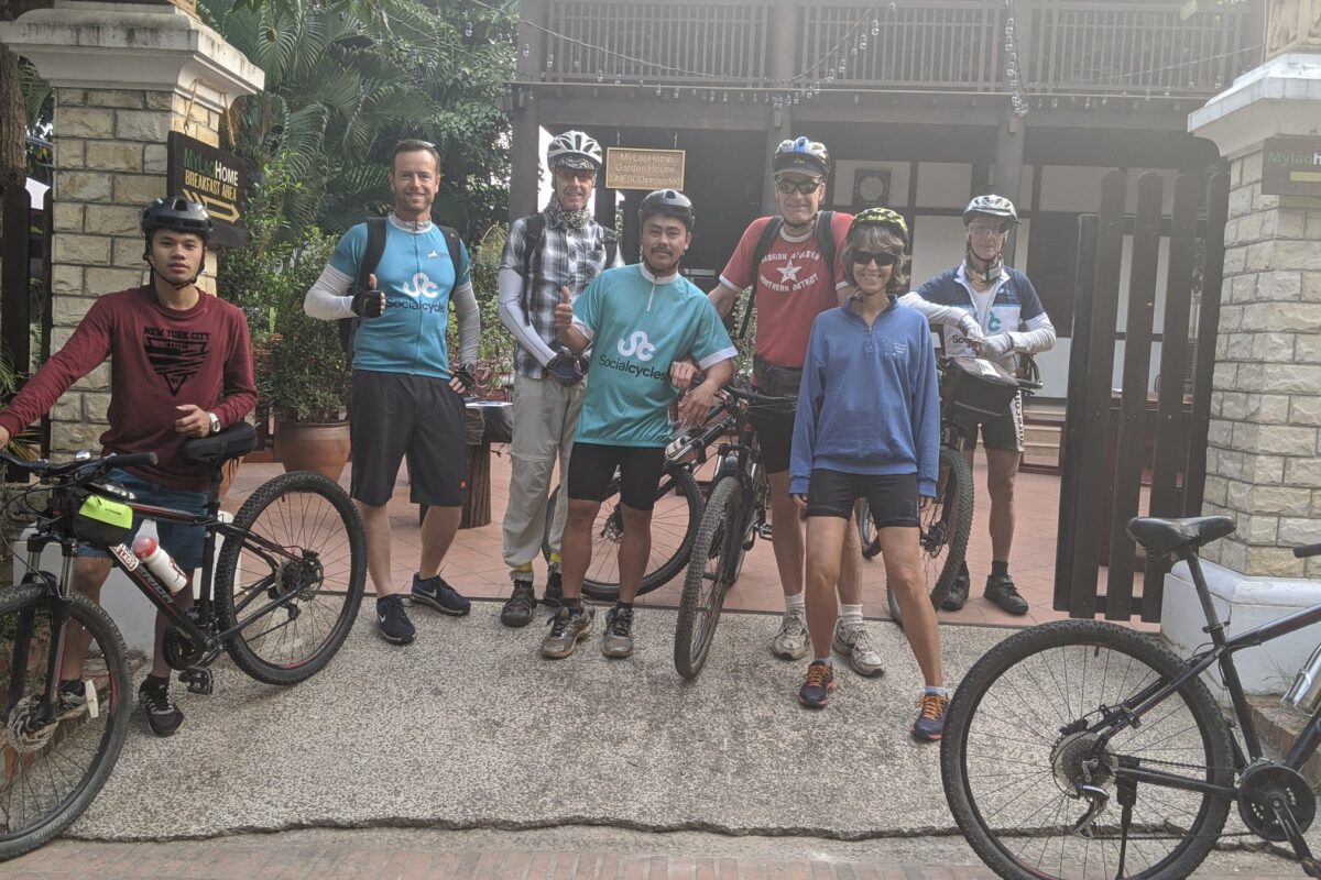 The group and their bikes at the hotel gate in Luang Prabang