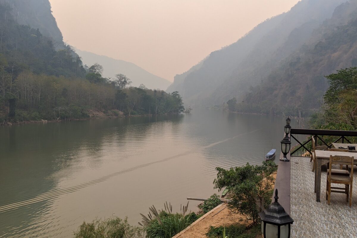 The Nam Ou river at dusk below the cliffs at Nong Khiaw