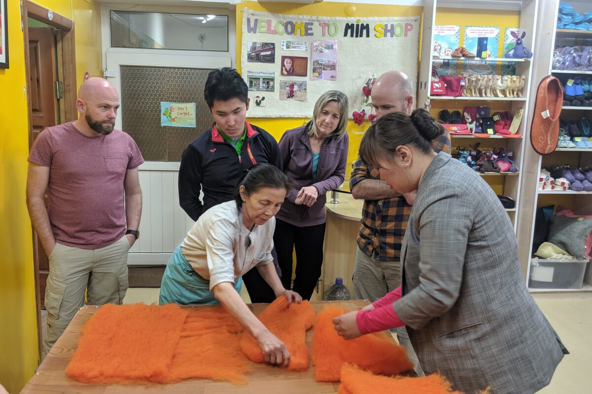 The group watches felt being laid out at Asral's workshop in Ulaanbaatar